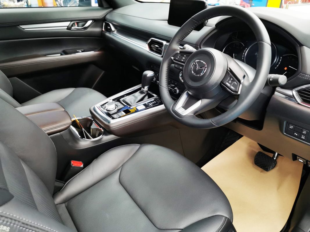 The Mazda CX-8 parked in the workshop, freshly coated.