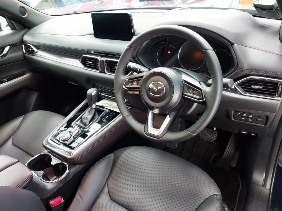 The Mazda CX-8 parked in the workshop, freshly coated.