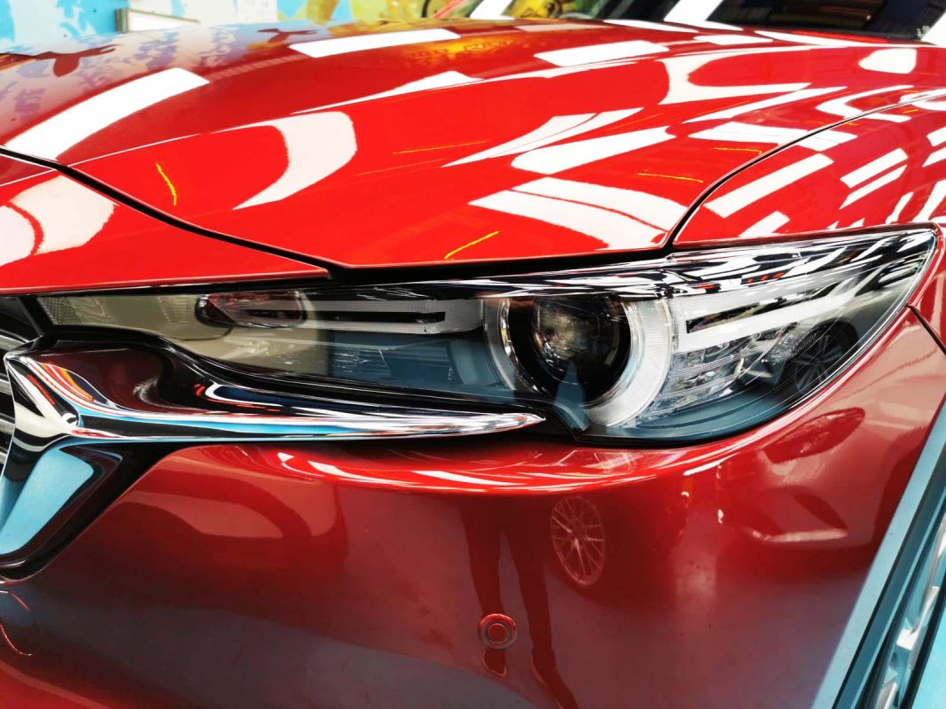 The CX-8's coated paintwork showing clean reflections.