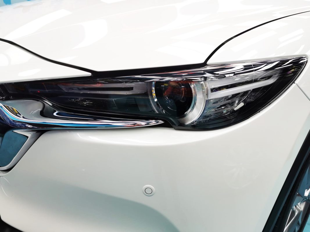 The CX-8's coated paintwork showing clean reflections.