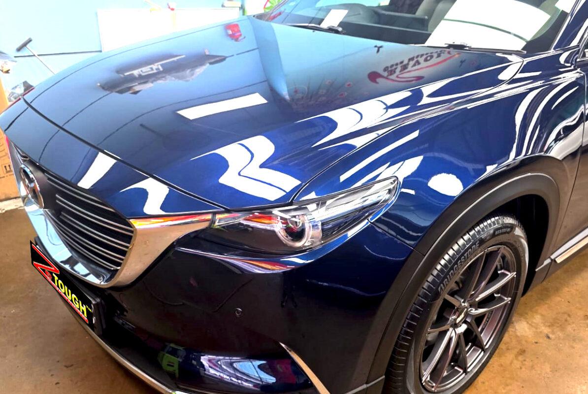 The Mazda CX-9 from a side angle after the ceramic coating.