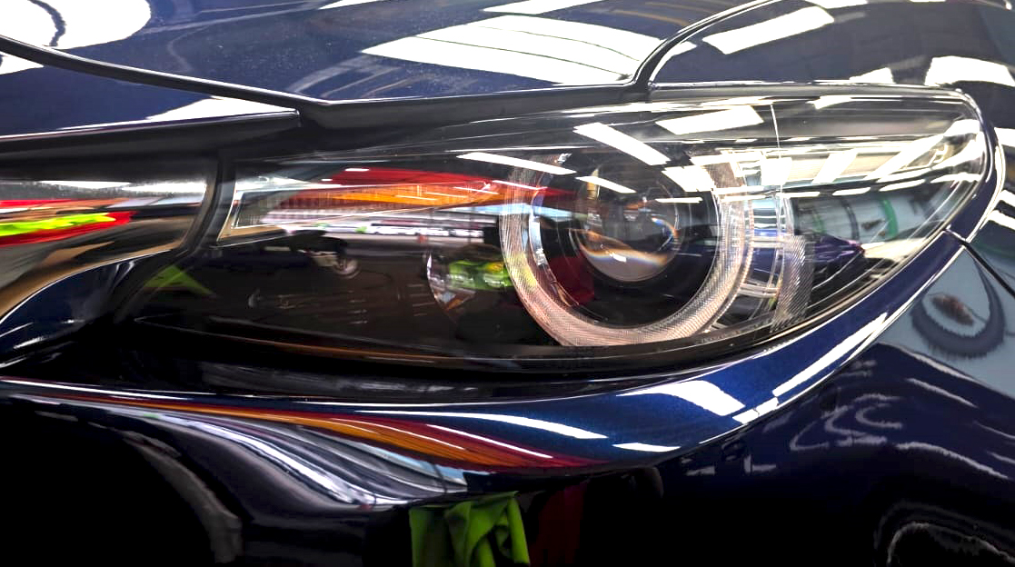 The CX-9's coated paintwork showing clean reflections.