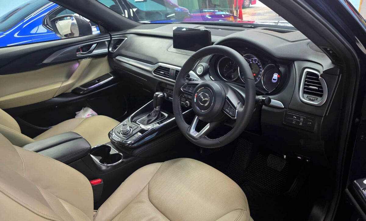 The Mazda CX-9 parked in the workshop, freshly coated.