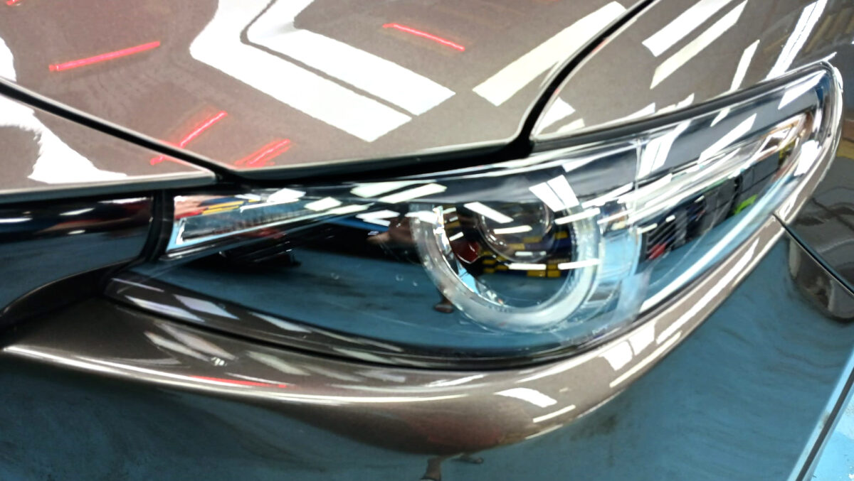 The CX-9's coated paintwork showing clean reflections.