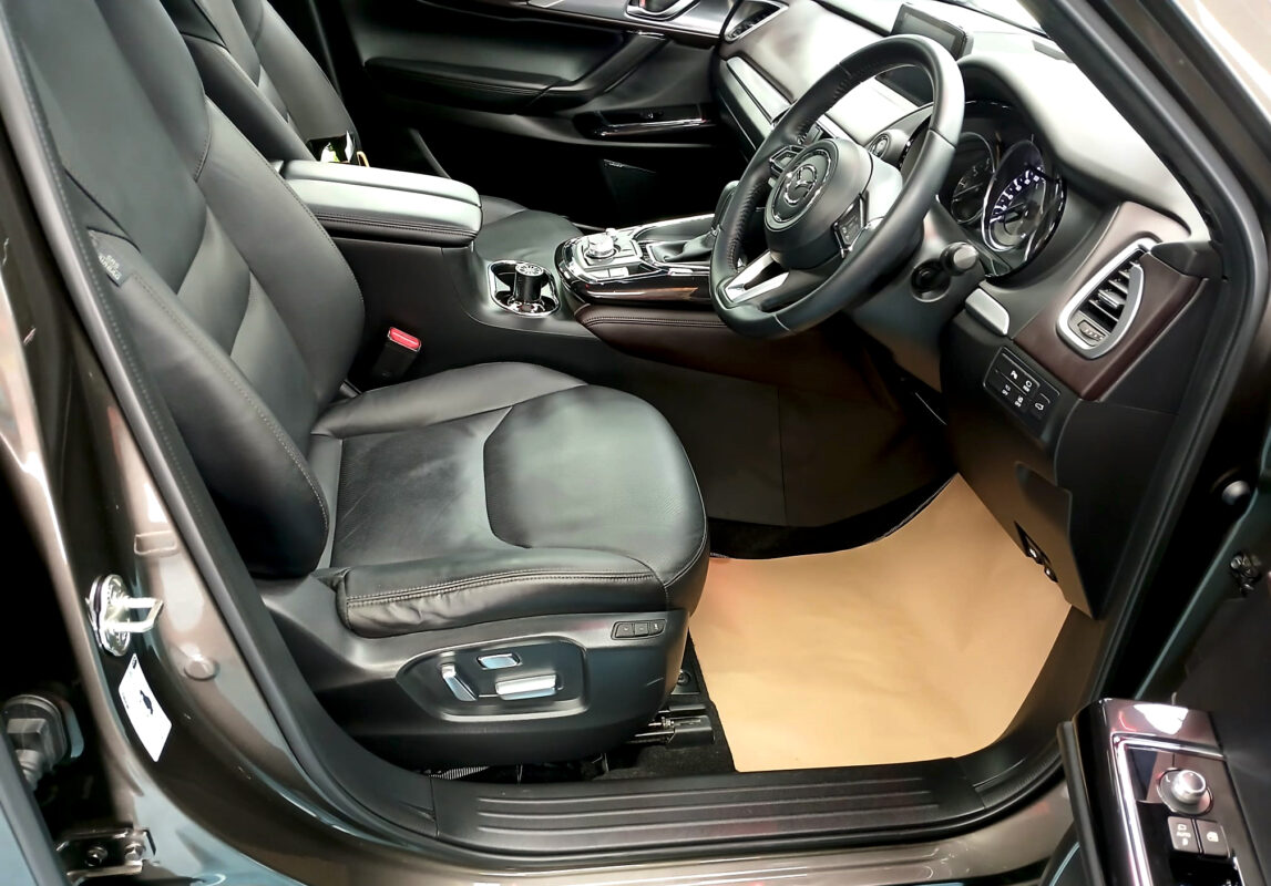 The Mazda CX-9 parked in the workshop, freshly coated.