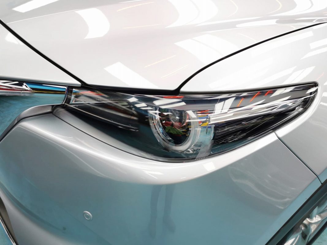 The CX-9's coated paintwork showing clean reflections.