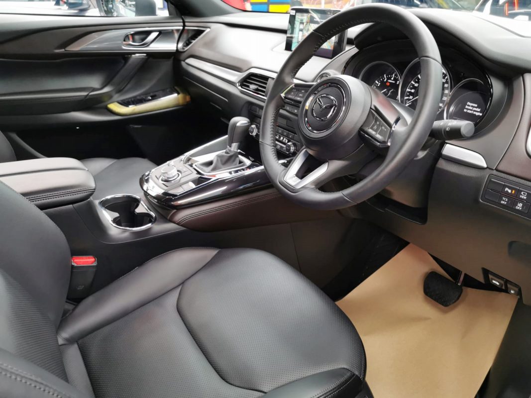The Mazda CX-9 parked in the workshop, freshly coated.