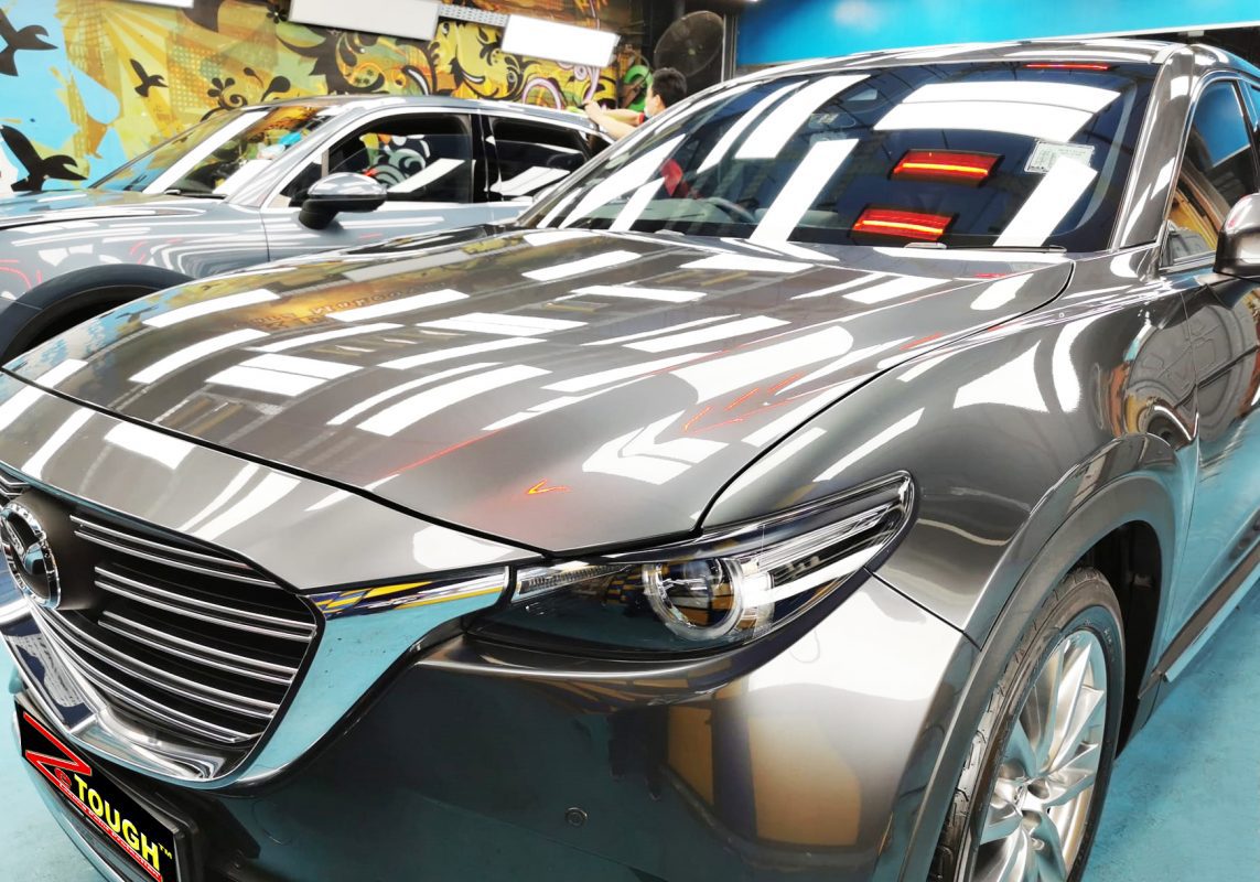 The Mazda CX-9 from a side angle after the ceramic coating.