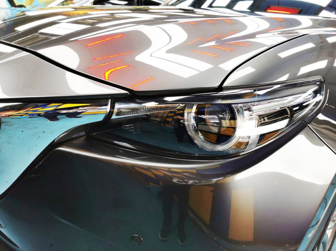 The CX-9's coated paintwork showing clean reflections.
