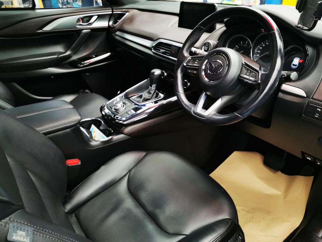 The Mazda CX-9 parked in the workshop, freshly coated.