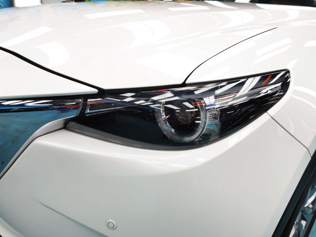 The CX-9's coated paintwork showing clean reflections.