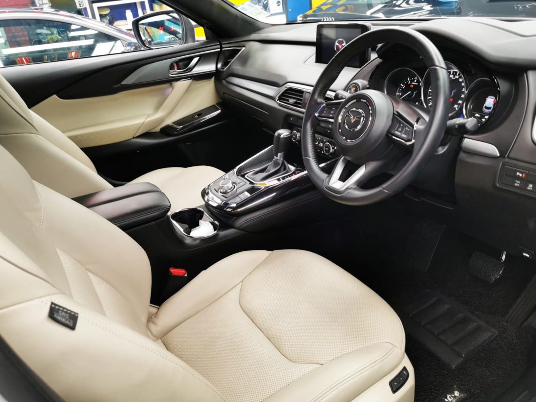 The Mazda CX-9 parked in the workshop, freshly coated.
