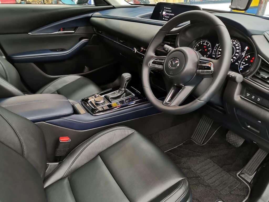 The Mazda CX-3 parked in the workshop, freshly coated.