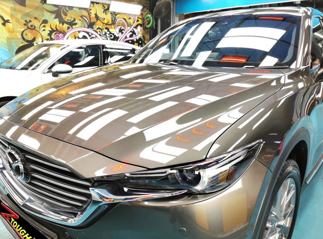 The Mazda CX-8 from a side angle after the ceramic coating.