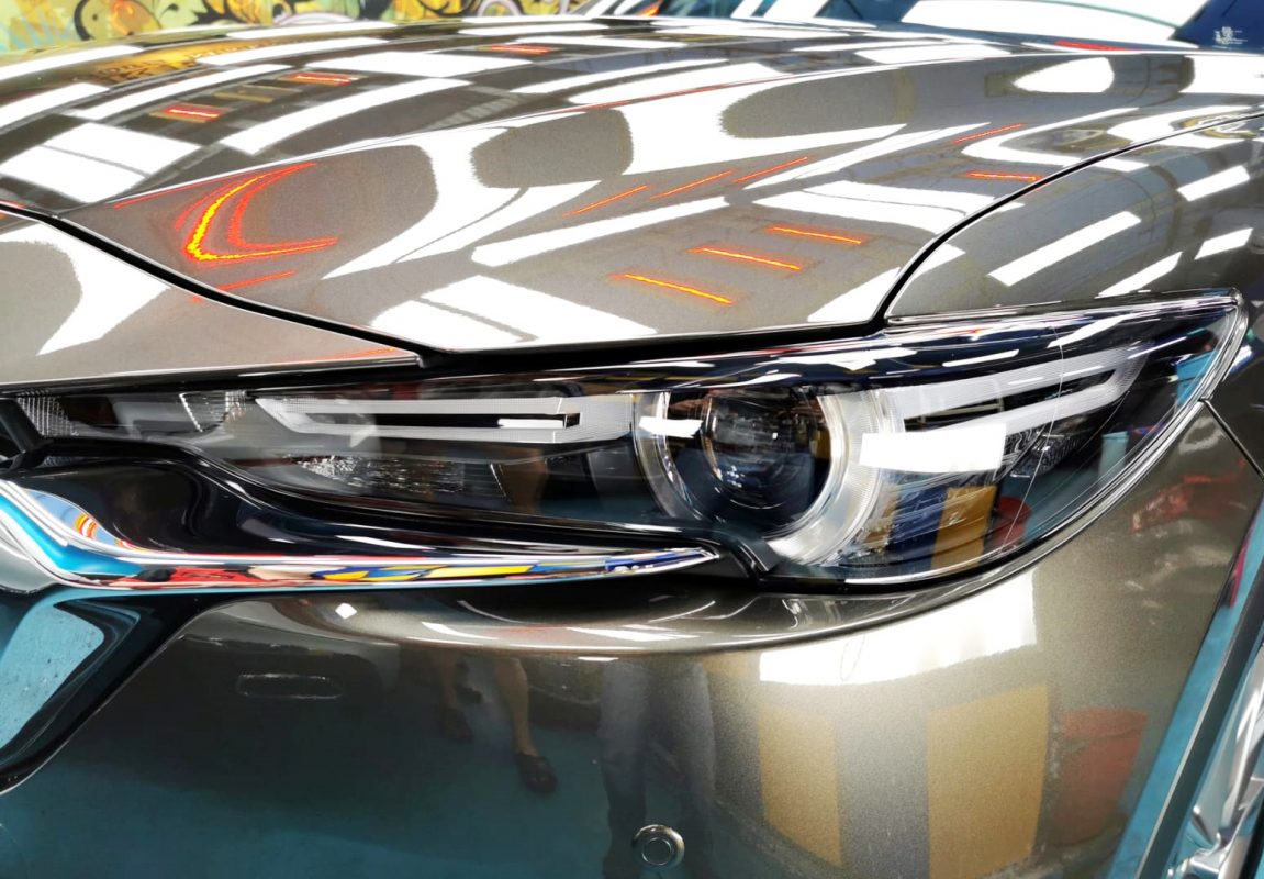 The CX-8's coated paintwork showing clean reflections.