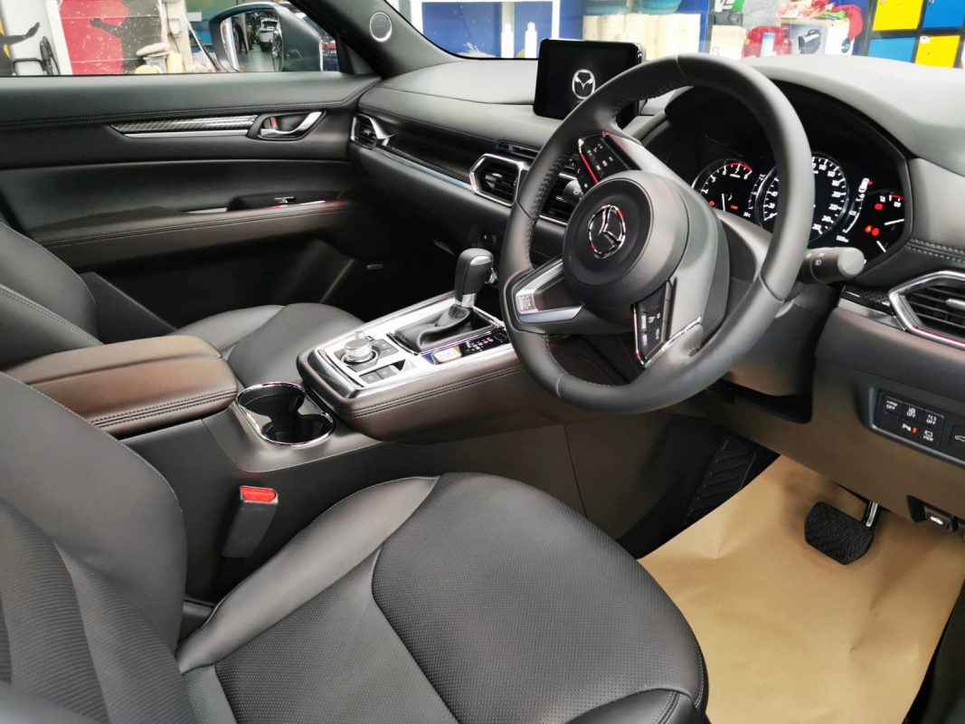 The Mazda CX-8 parked in the workshop, freshly coated.