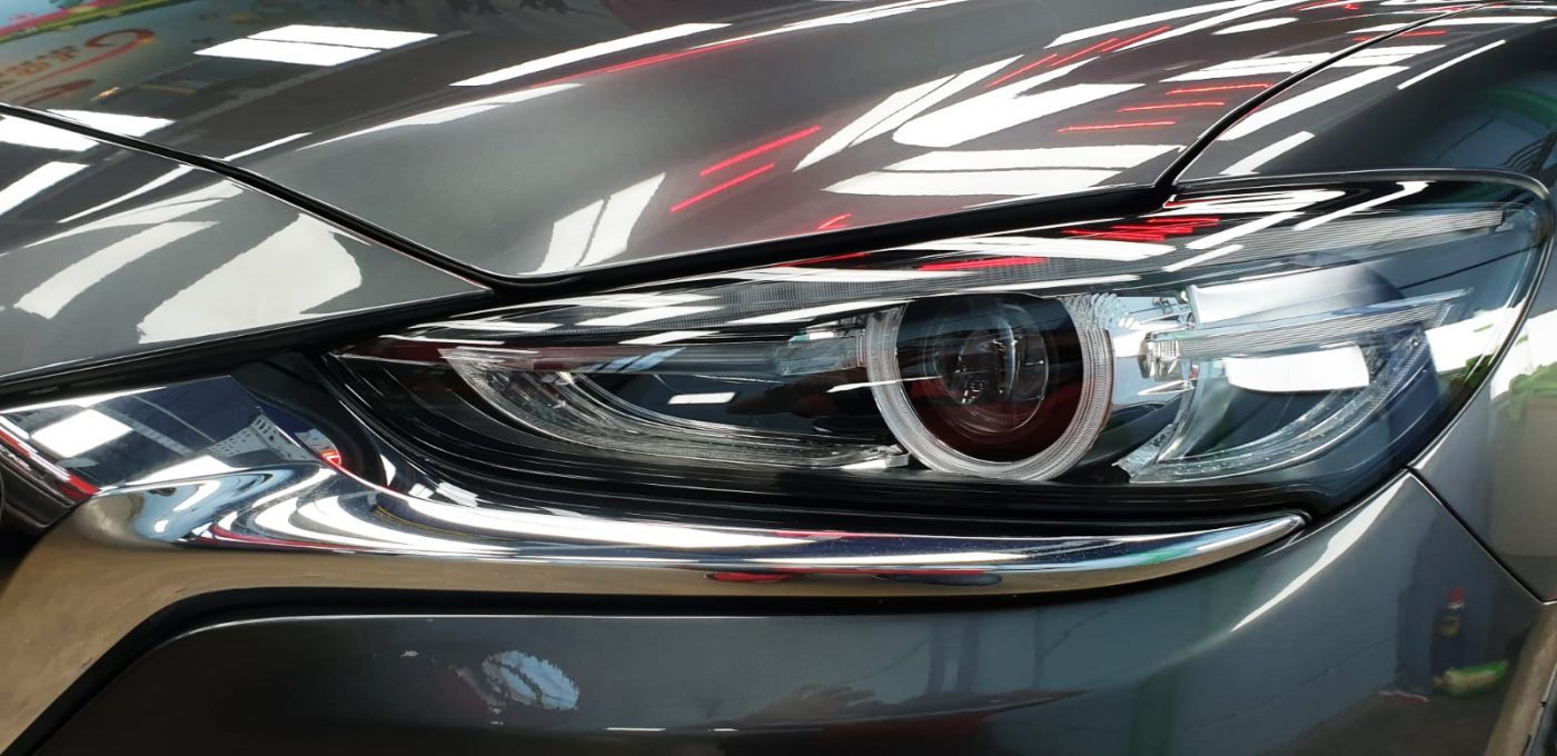 The Mazda 6's coated paintwork showing clean reflections.