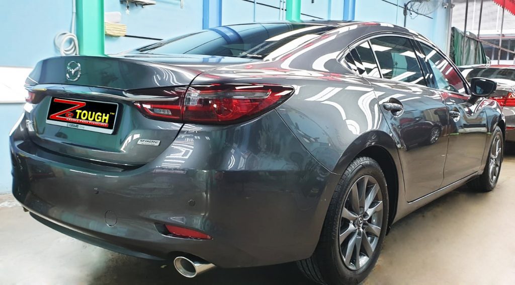 Rear quarter of the Mazda 6, glossy and protected.