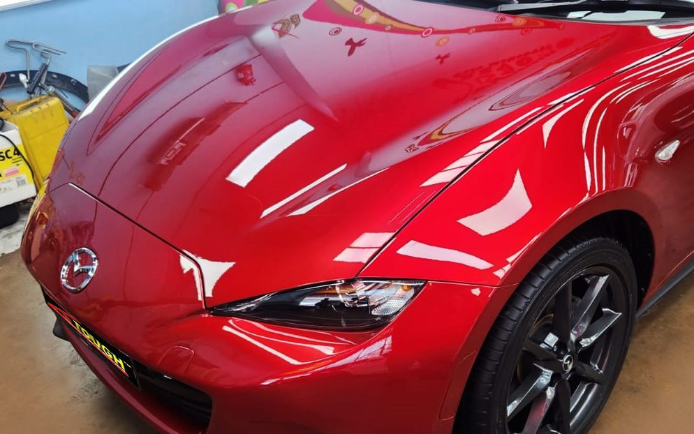 The Mazda MX-5 from a side angle after the ceramic coating.