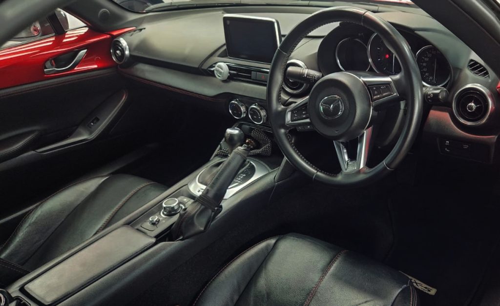 The Mazda MX-5 parked in the workshop, freshly coated.
