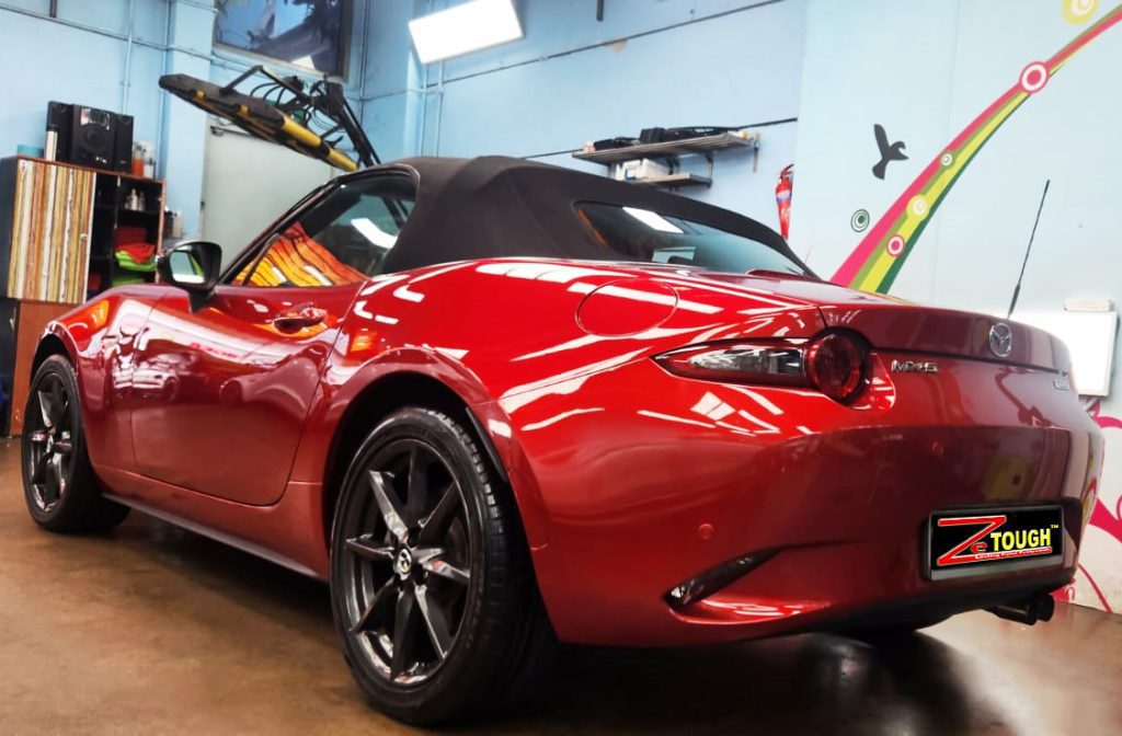 Rear quarter of the Mazda MX-5, glossy and protected.