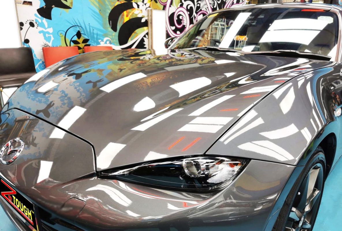The Mazda MX-5 from a side angle after the ceramic coating.