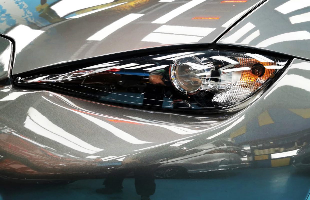 The MX-5's coated paintwork showing clean reflections.