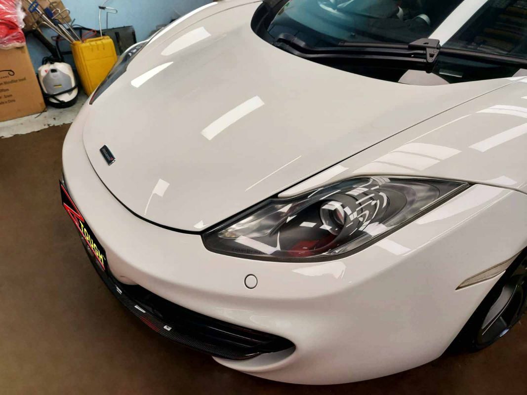 The McLaren MP4 from a side angle after the ceramic coating.
