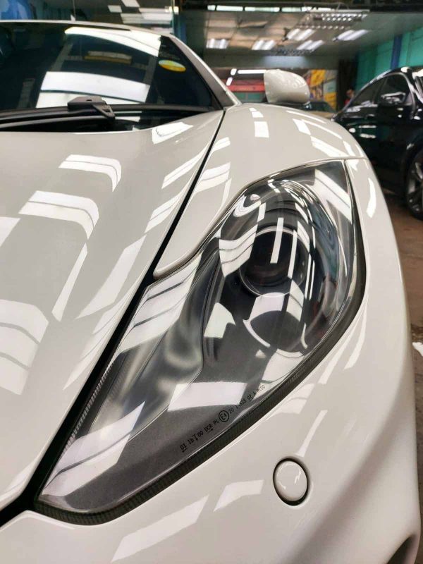 The McLaren MP4's coated paintwork showing clean reflections.