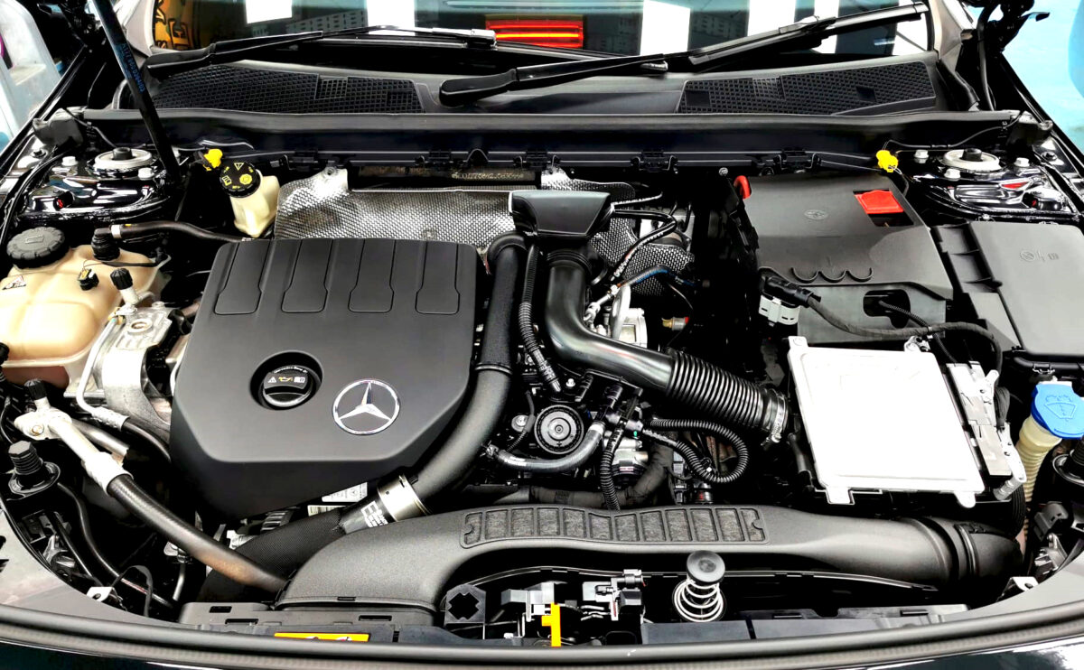 Reflections across the coated panels of the Mercedes-Benz A180.
