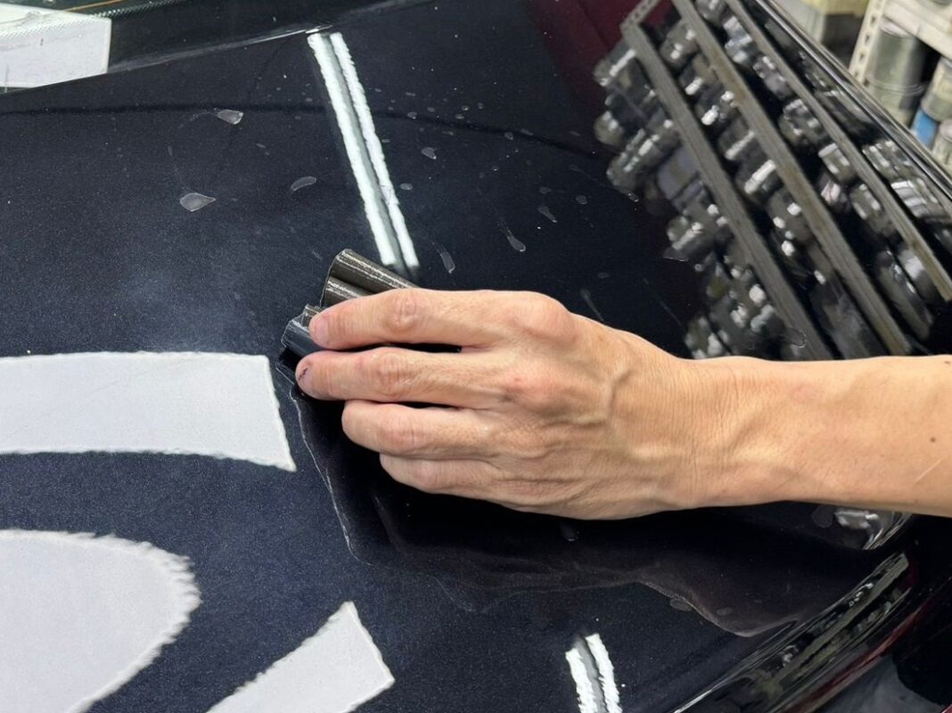 Machine-polishing the A180 after the respray to bring up the gloss.