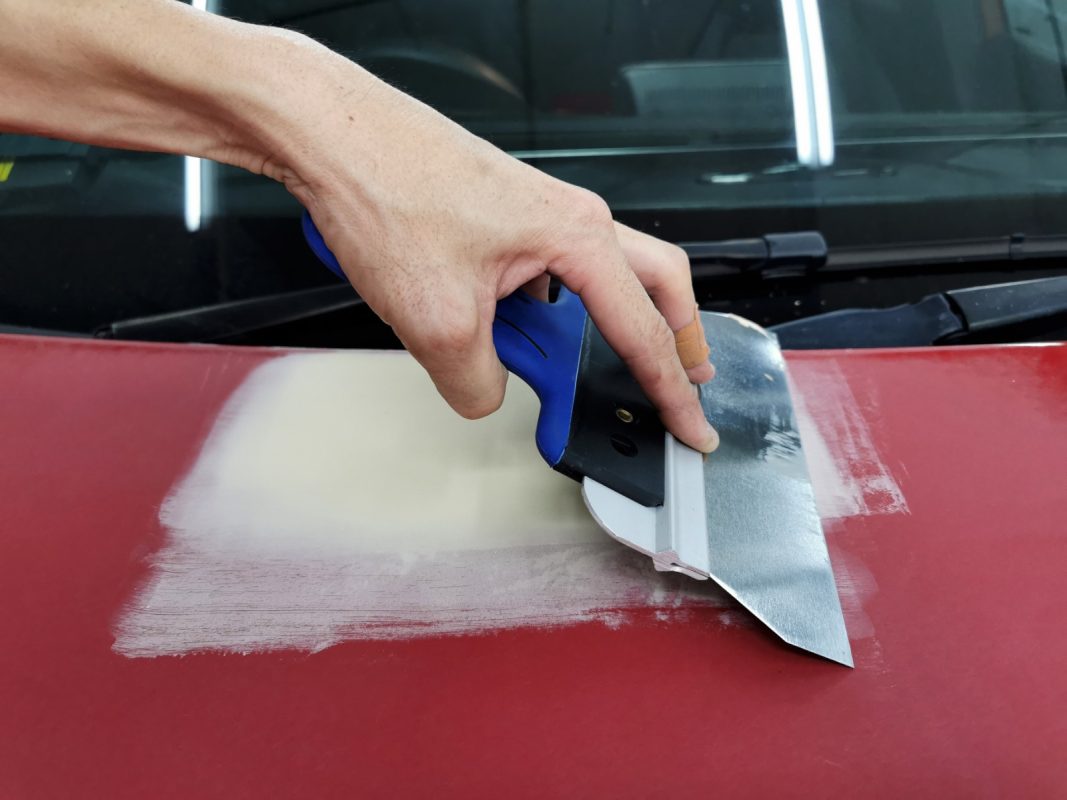 Filler and patching work on a panel of the Mercedes-Benz A180.