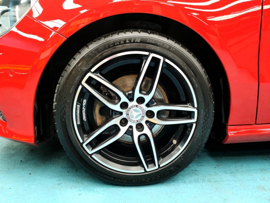 After: the same car, resprayed to a deep, even gloss.