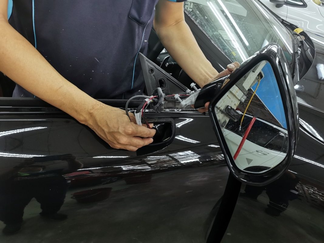 Parts being dismantled from the AMG E53 in preparation for spraying.
