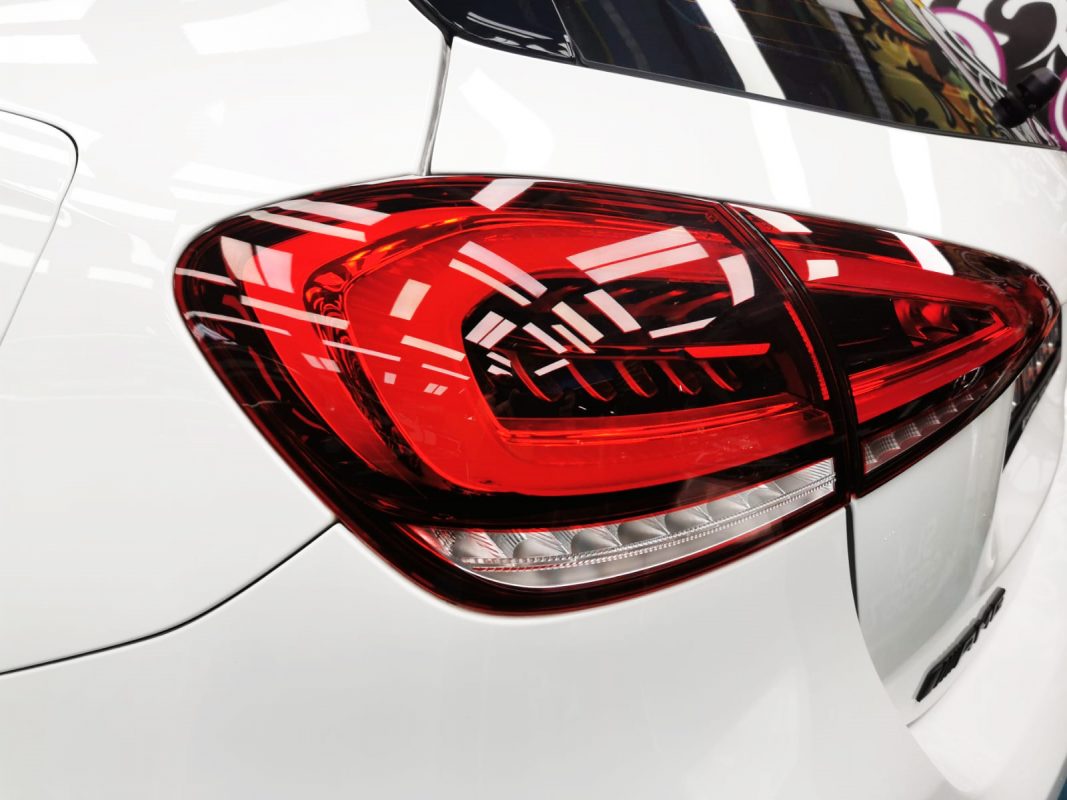 The coated bonnet of the AMG 35 under workshop lighting.