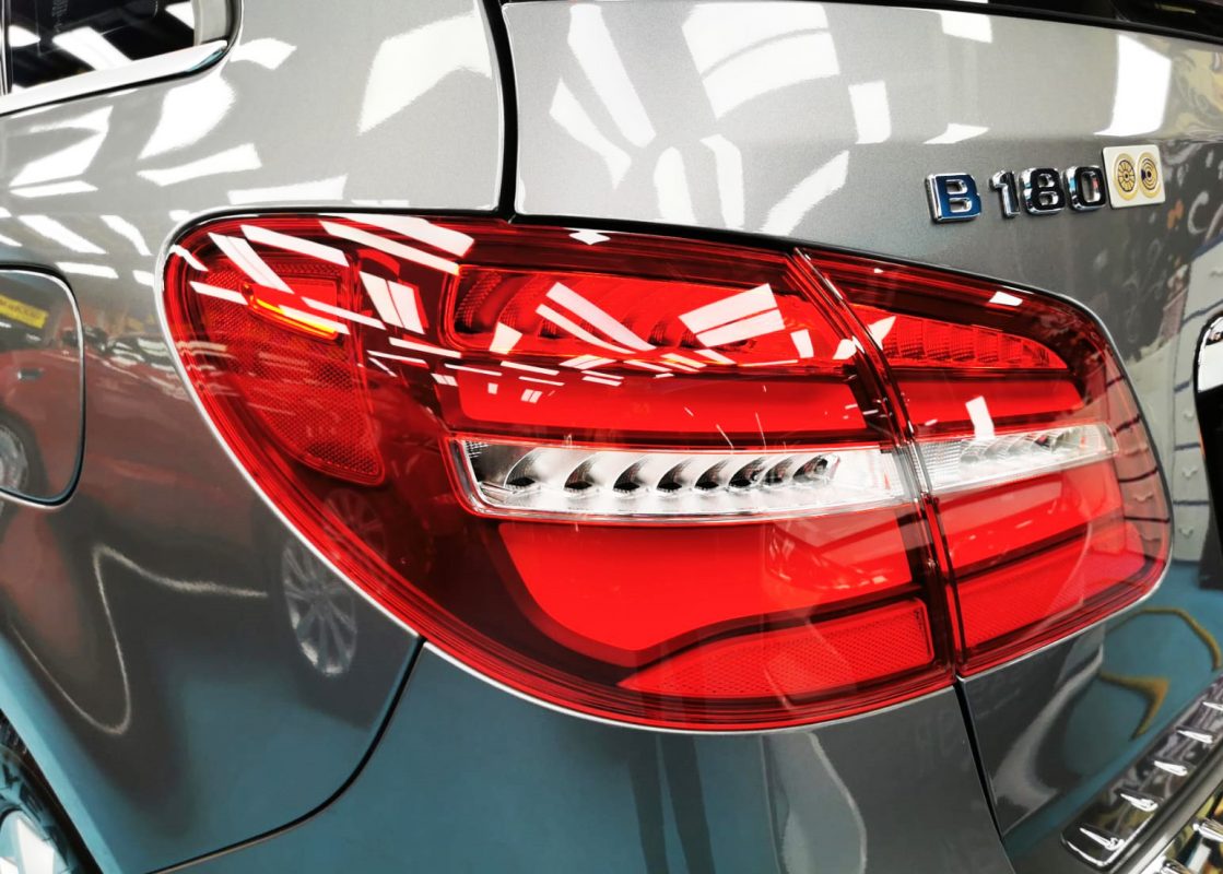 The coated bonnet of the B180 under workshop lighting.