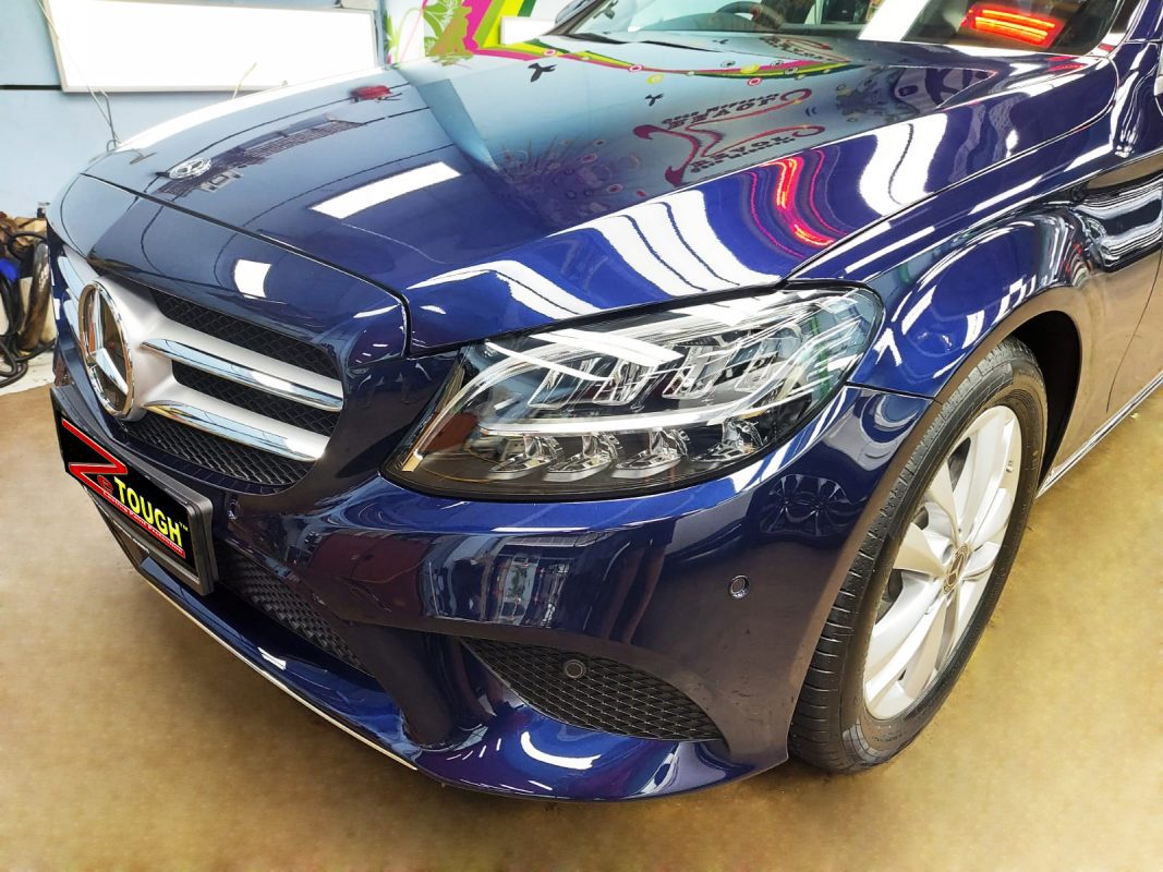 The Mercedes-Benz C160 from a side angle after the ceramic coating.