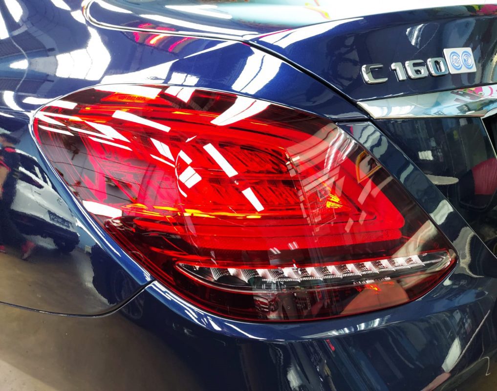 The coated bonnet of the C160 under workshop lighting.
