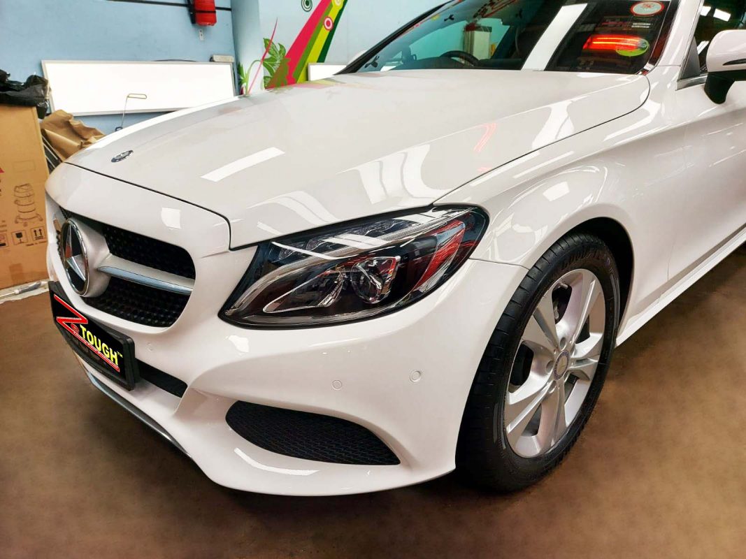 The Mercedes-Benz C180 from a side angle after the ceramic coating.