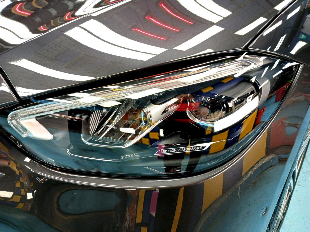 The C180's coated paintwork showing clean reflections.