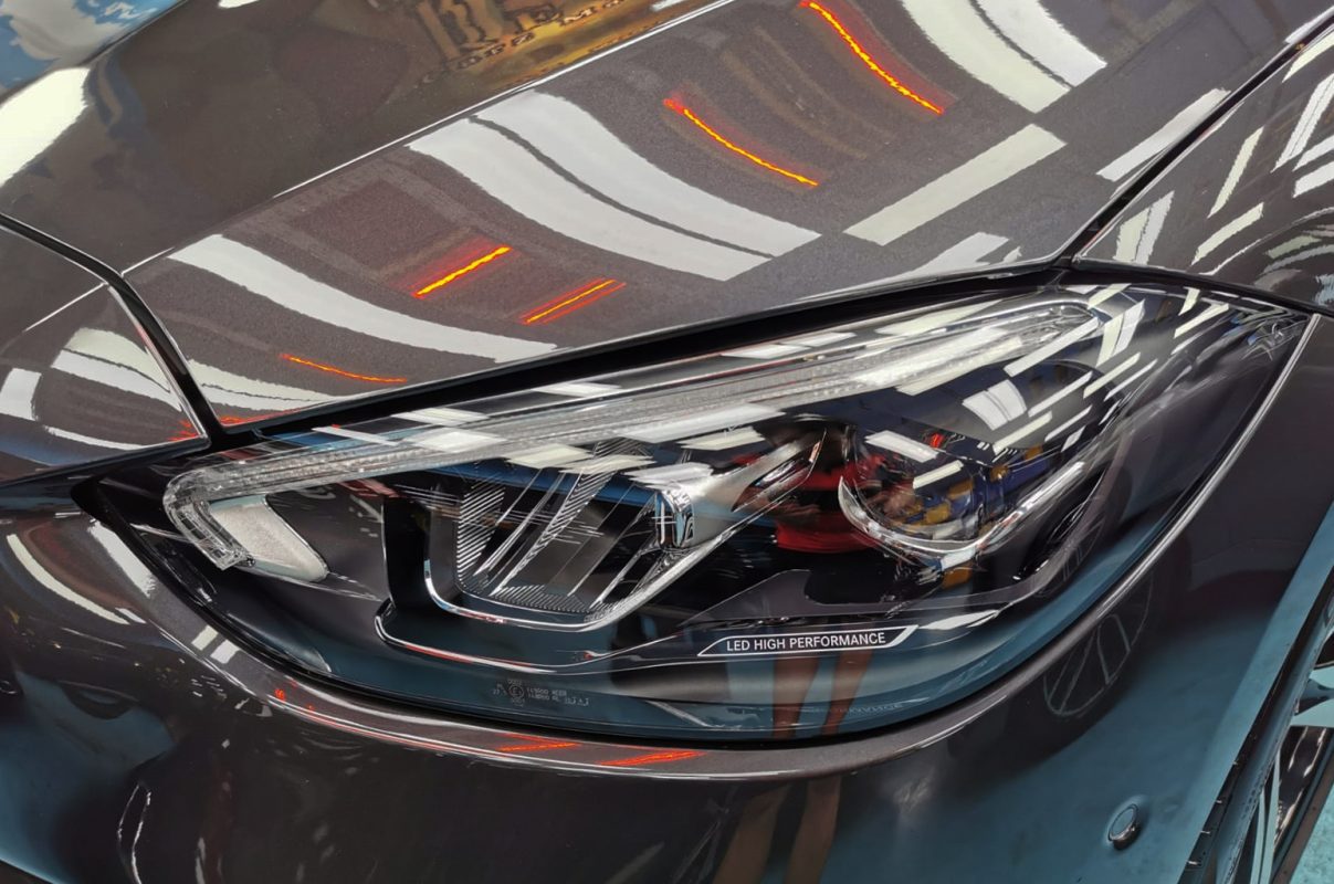 The C180's coated paintwork showing clean reflections.