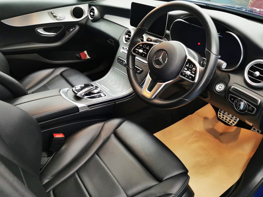 The Mercedes-Benz C180 parked in the workshop, freshly coated.
