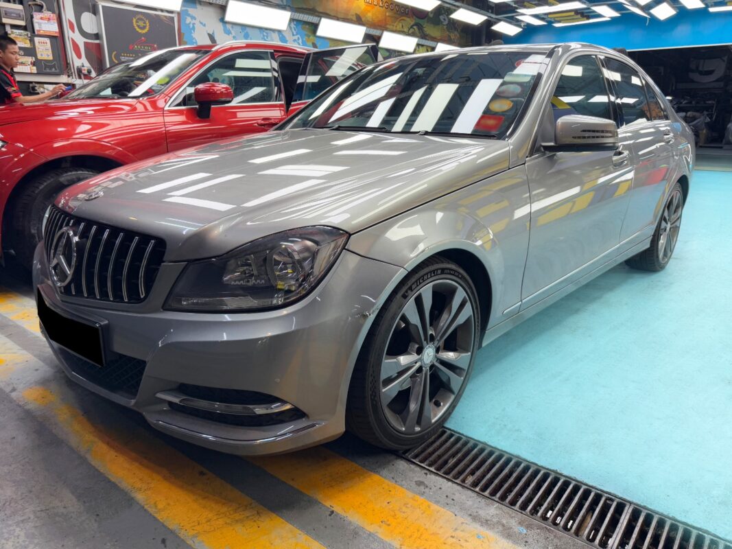 The Mercedes-Benz C180 as it arrived at Revol Carz, front view showing the tired paintwork.