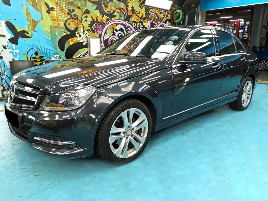The Mercedes-Benz C180 as it arrived at Revol Carz, showing the faded and chipped paintwork.
