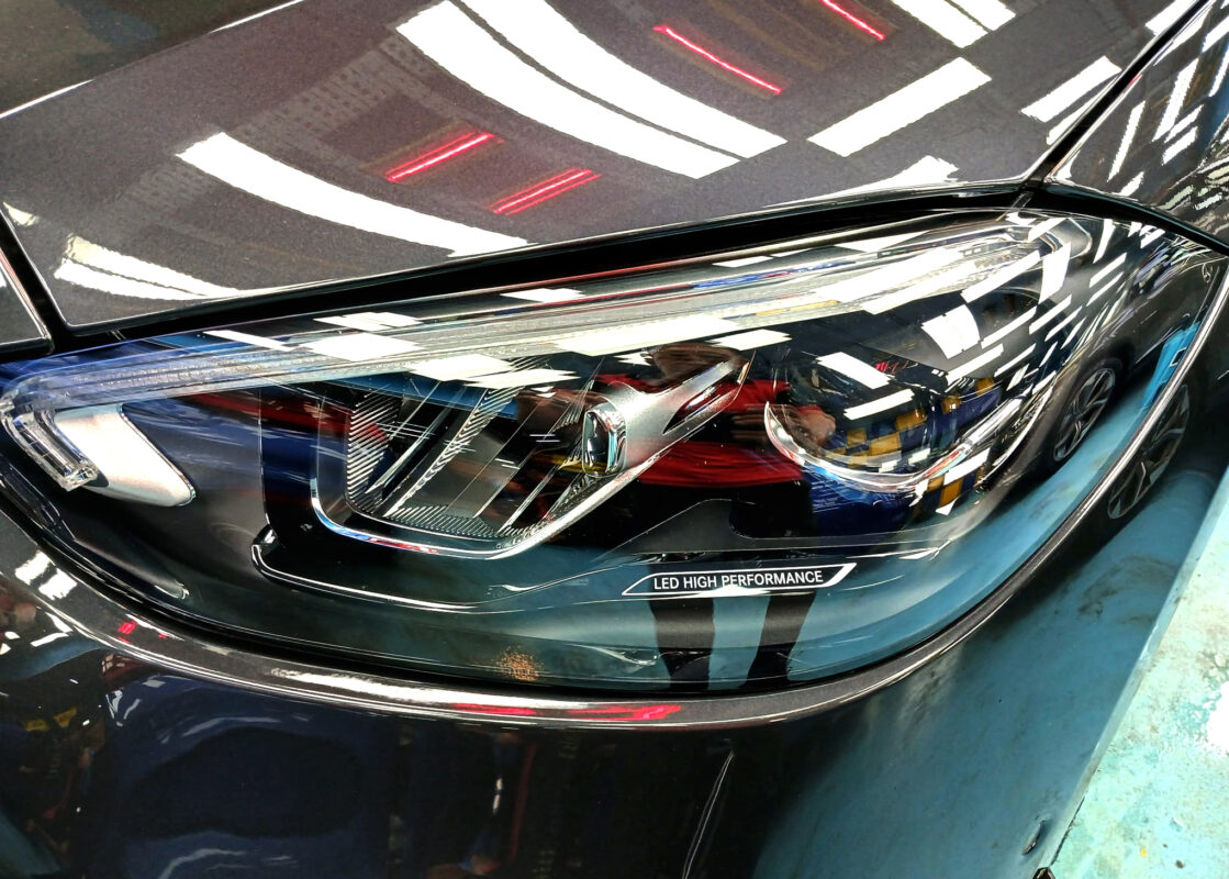 The C180's coated paintwork showing clean reflections.
