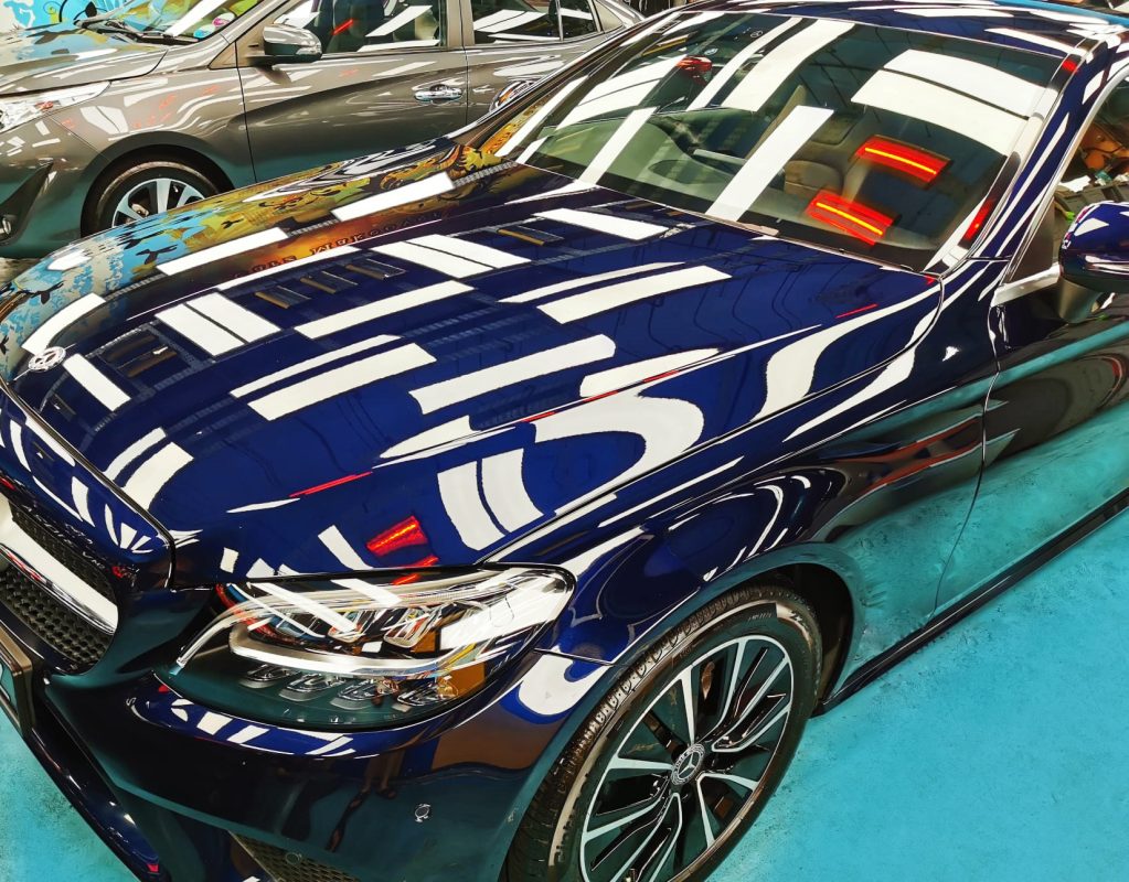 The Mercedes-Benz C180 from a side angle after the ceramic coating.