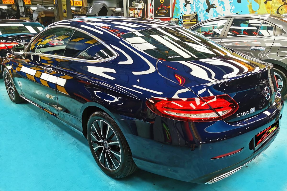 Rear quarter of the Mercedes-Benz C180, glossy and protected.