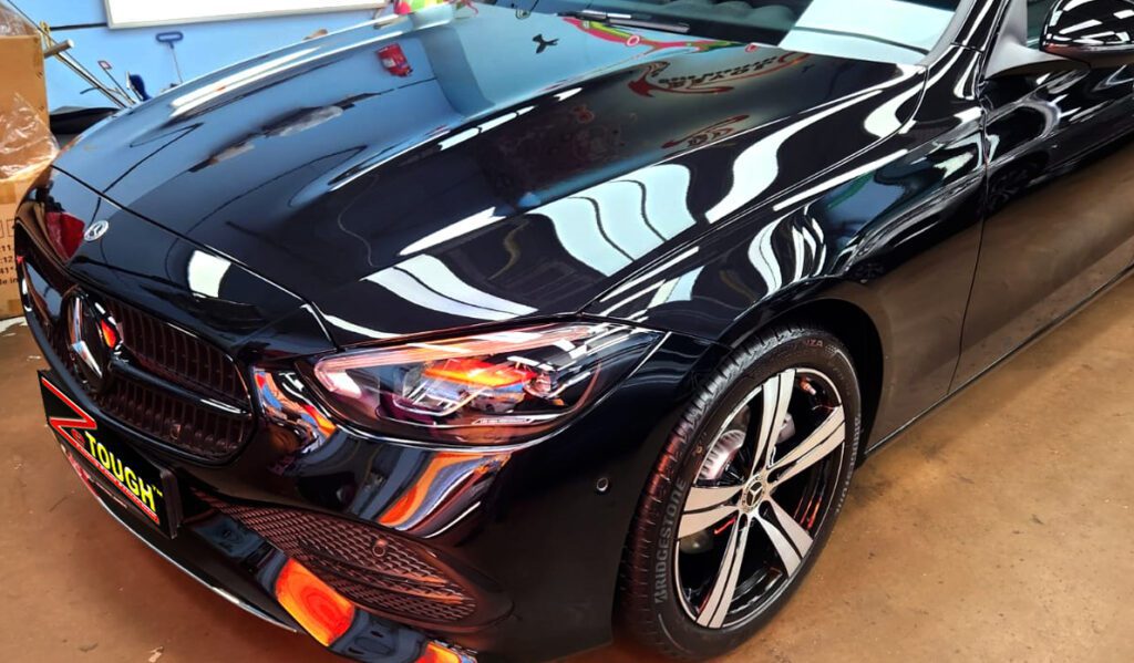 The Mercedes-Benz C180 from a side angle after the ceramic coating.