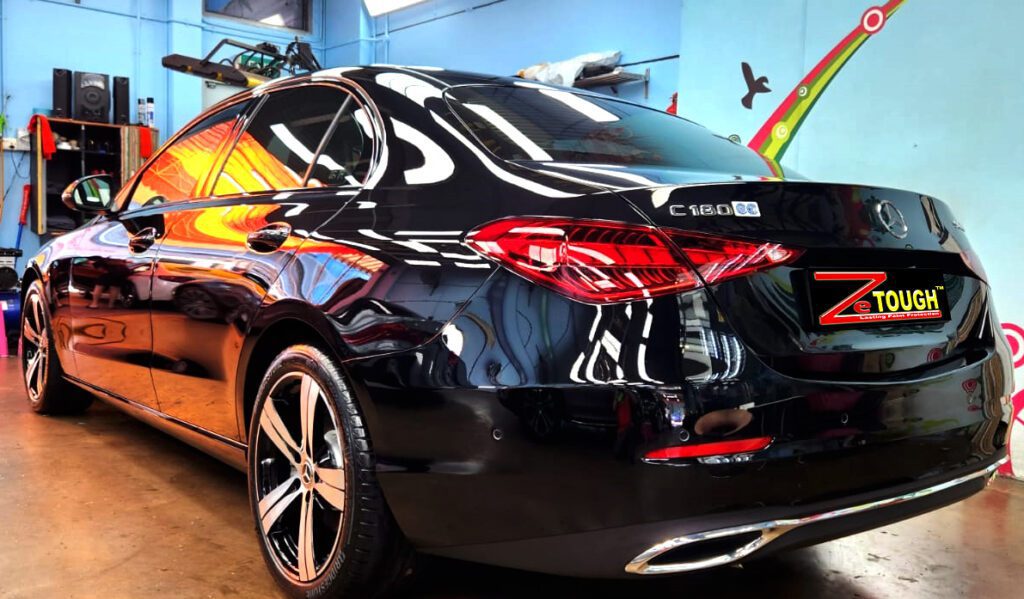 Rear quarter of the Mercedes-Benz C180, glossy and protected.