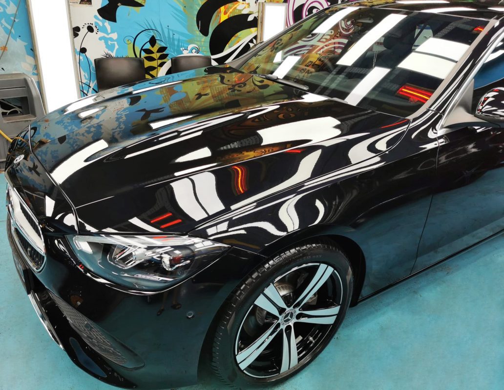 The Mercedes-Benz C180 from a side angle after the ceramic coating.